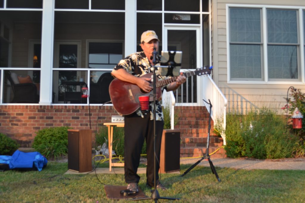 Wayne singing at lawn concert