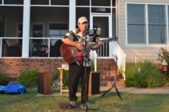 Wayne singing at lawn concert