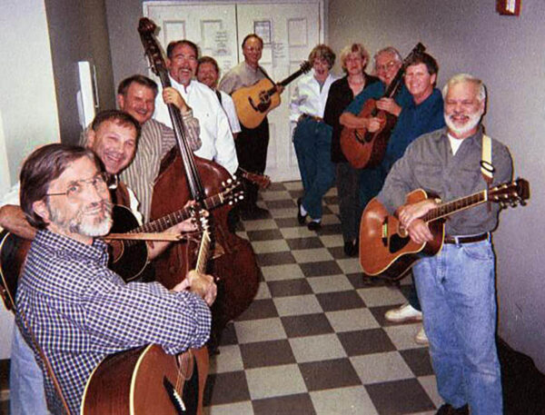 ALL the performers waiting to go on for the closing number - beyond those white doors await a gym full of 60s-era folk fans