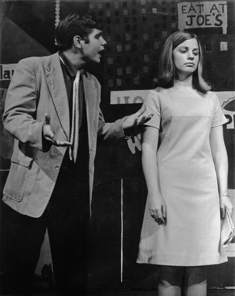 As Nathan Detroit in Guys and Dolls, Wayne Sings "So Sue Me" to Irene Mathieson